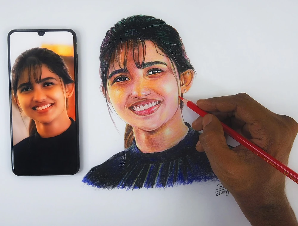 Artist Siraj drawing a color pencil portrait from a reference photo